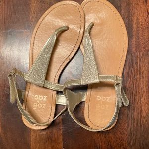 Gold gladiator sandals.